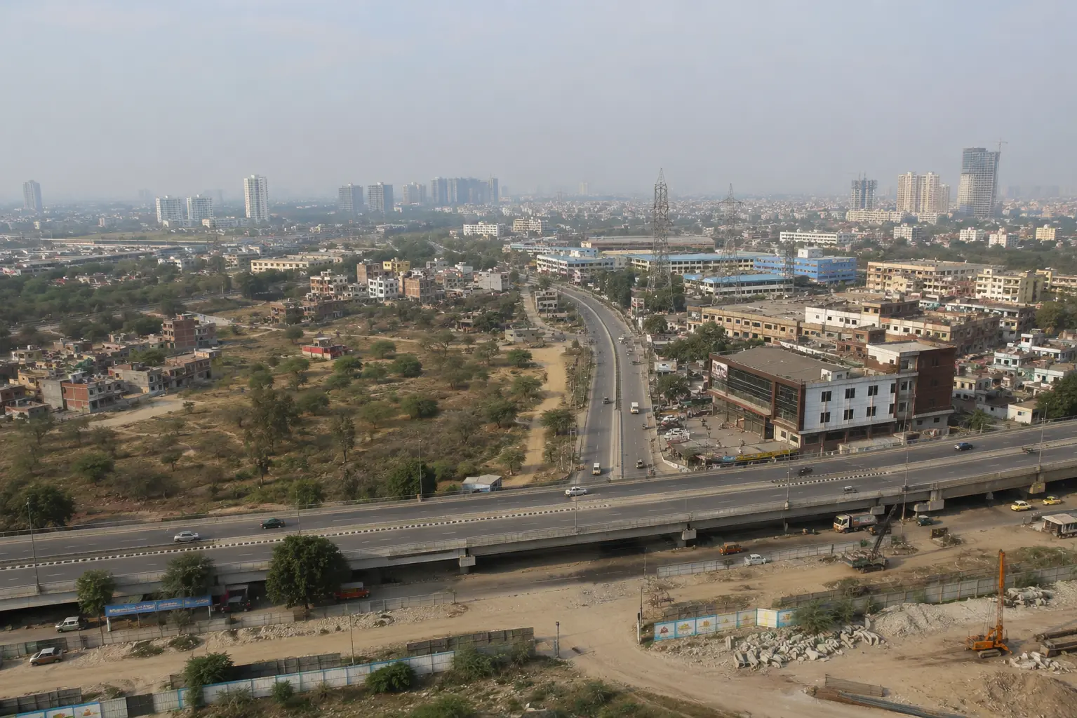 Aerial view of Ghaziabad roads, flyover, and rising towers as GDA development reshapes growth belts in 2026
